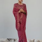 Fuchsia colored saree with embroidered blouse
