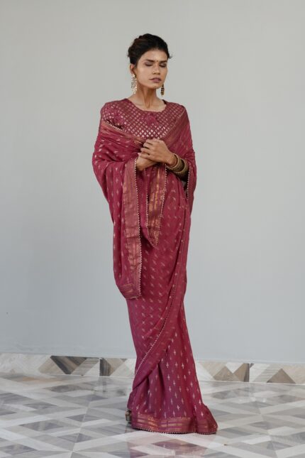 Fuchsia colored saree with embroidered blouse